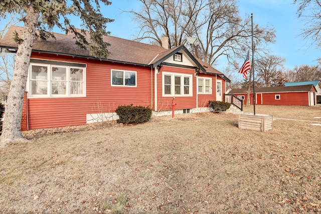 view of home's exterior with a lawn