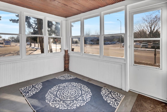 sunroom / solarium featuring wooden ceiling