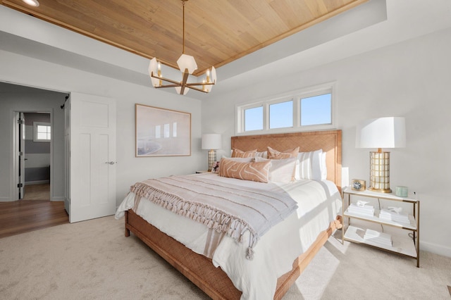 carpeted bedroom with a chandelier and wood ceiling