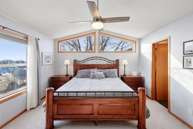 bedroom featuring lofted ceiling, light colored carpet, and ceiling fan