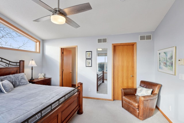 bedroom featuring light carpet and ceiling fan