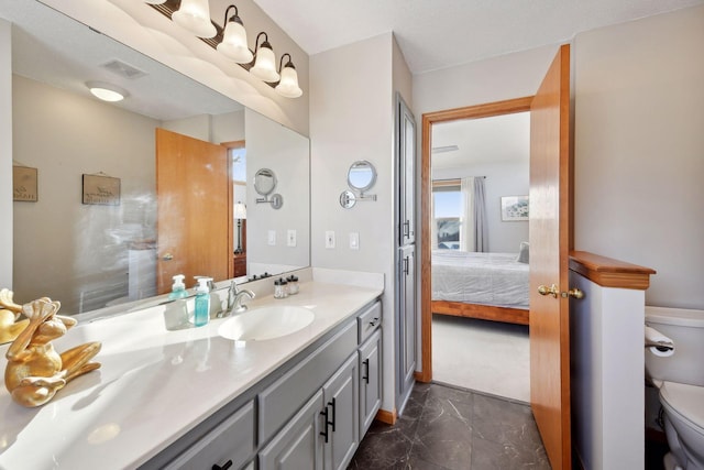 bathroom with vanity and toilet