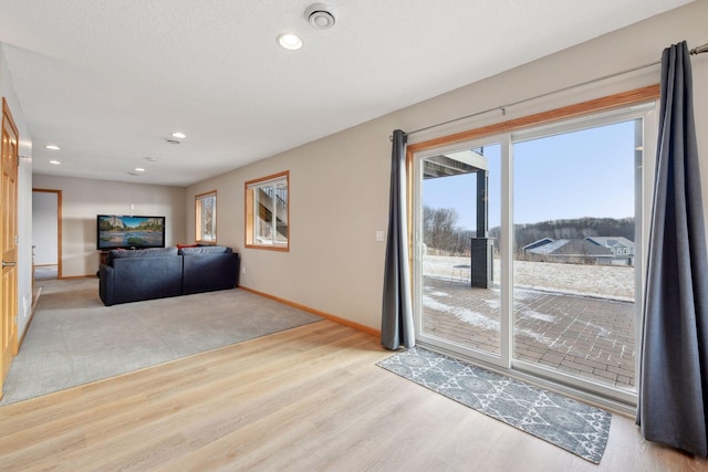 unfurnished living room featuring light wood-type flooring