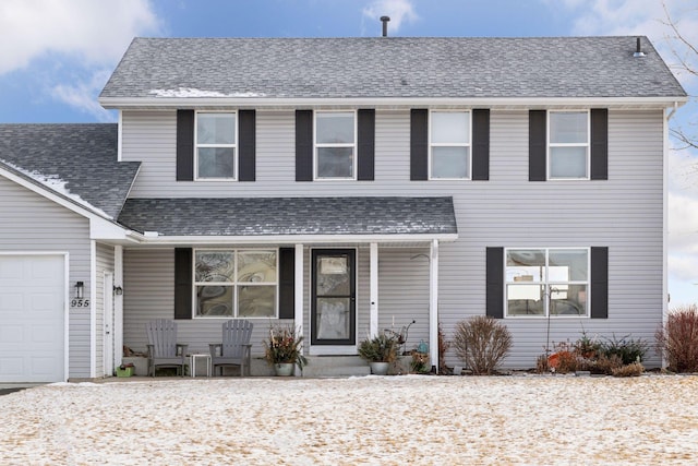 front of property with a garage