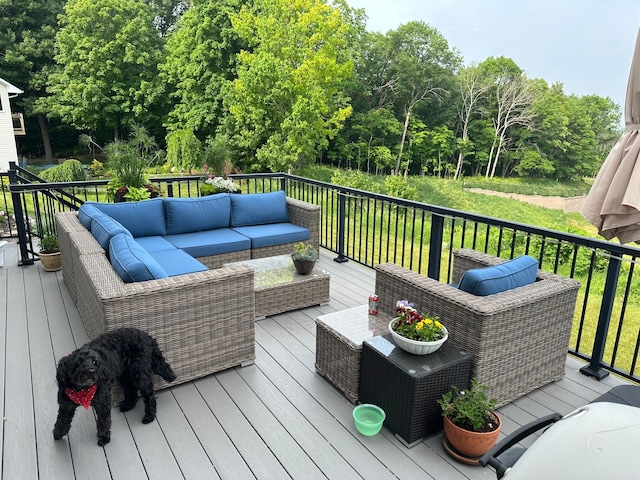 wooden terrace featuring an outdoor hangout area