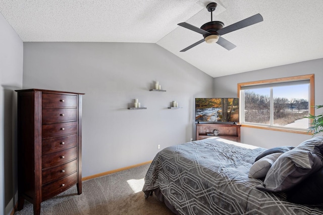 bedroom featuring vaulted ceiling, carpet flooring, baseboards, and a textured ceiling