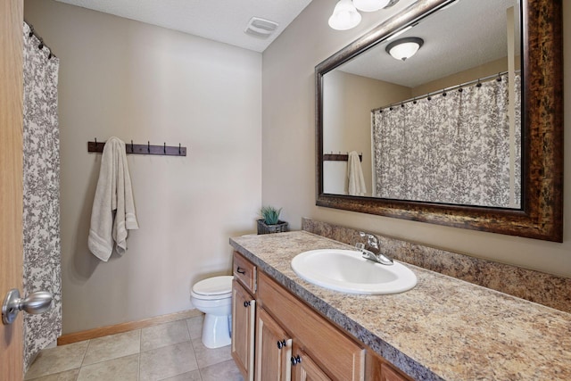 full bath with vanity, baseboards, visible vents, tile patterned flooring, and toilet