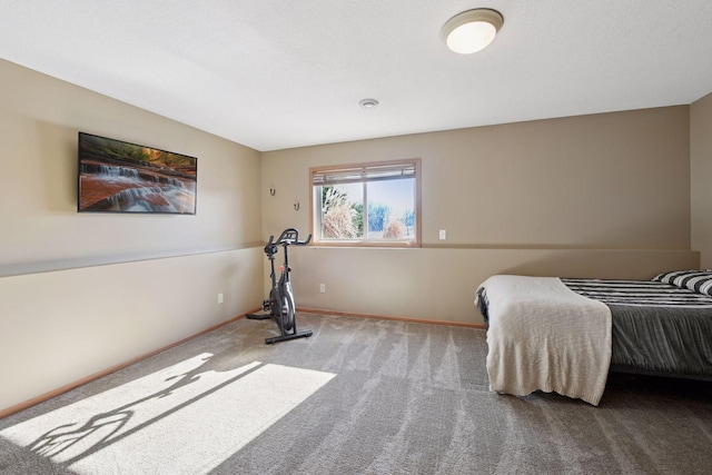 bedroom featuring carpet flooring and baseboards