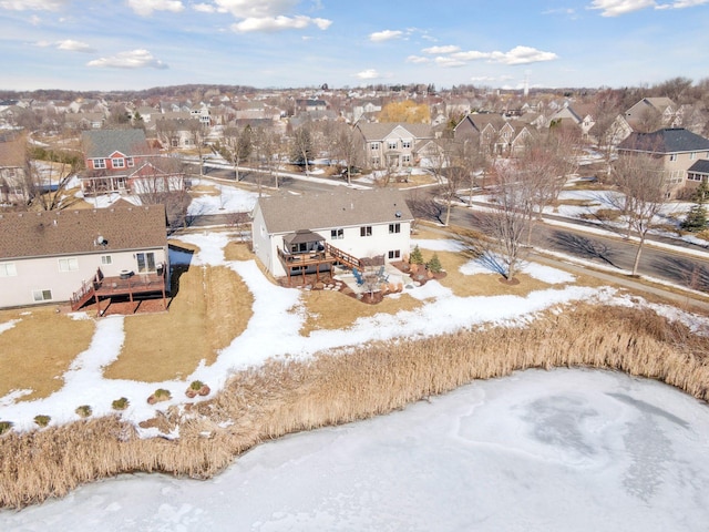 snowy aerial view featuring a residential view