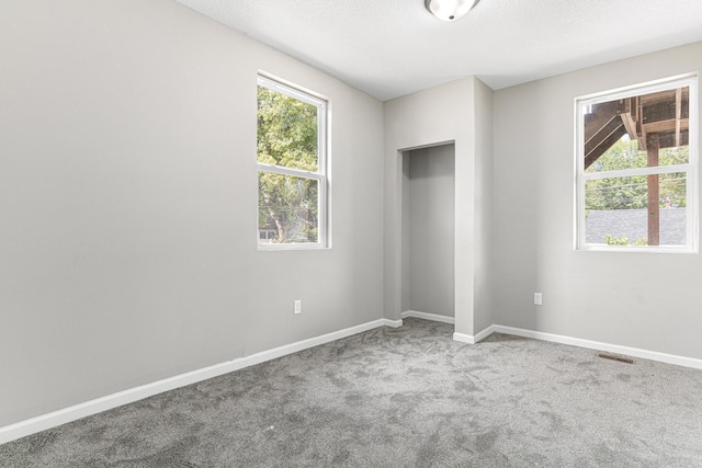 empty room featuring carpet flooring