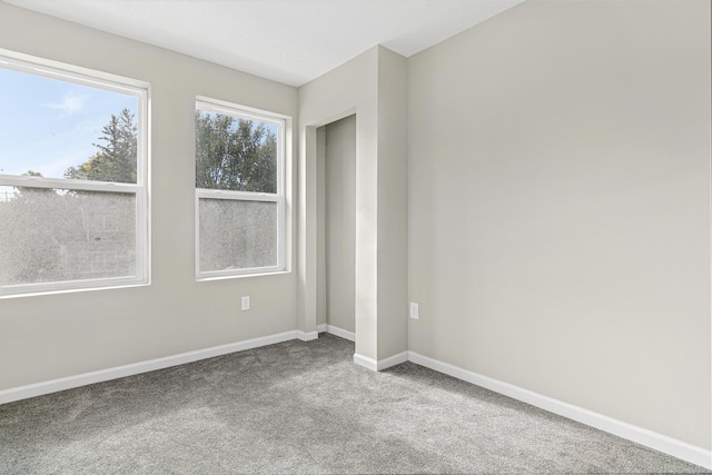 empty room featuring carpet flooring