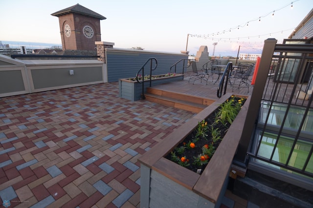 view of patio terrace at dusk