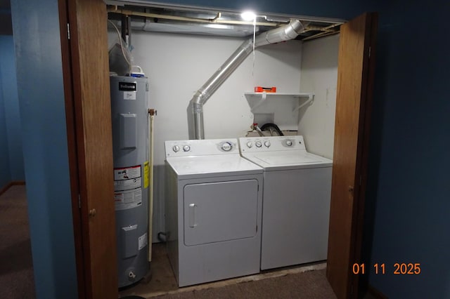 laundry room featuring electric water heater and washing machine and dryer