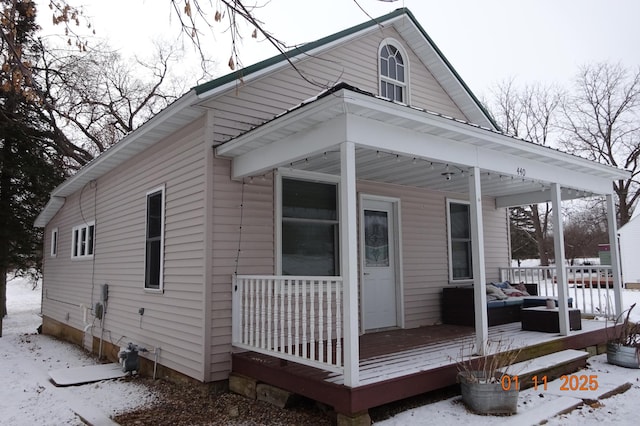 exterior space with an outdoor living space and a porch