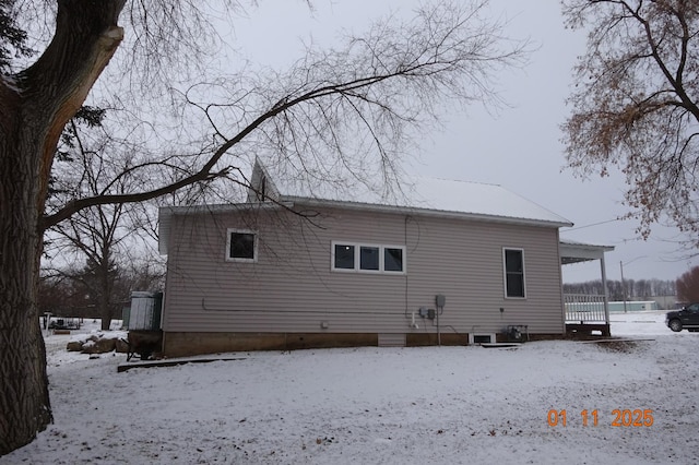 view of snow covered house