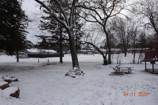 view of yard layered in snow