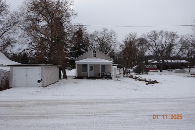 view of front of house featuring a storage shed