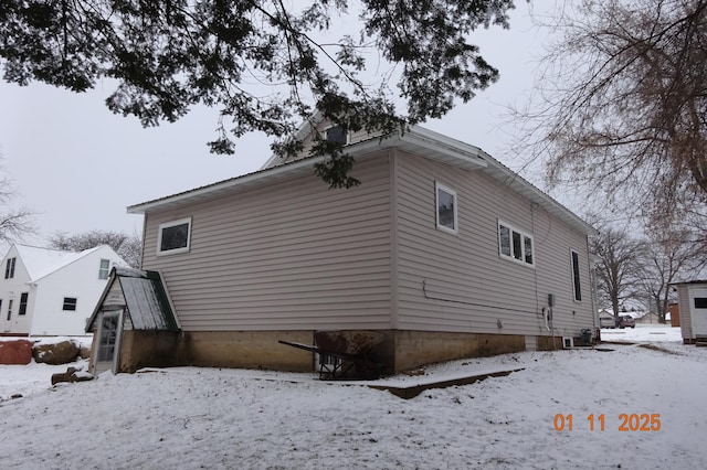 view of snow covered property