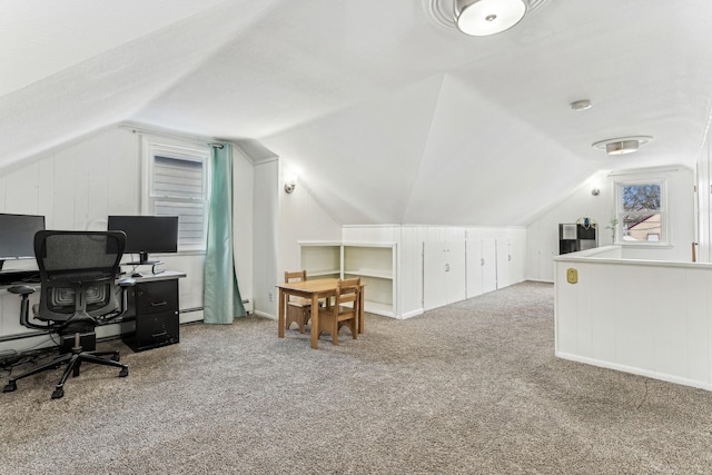 carpeted home office featuring lofted ceiling and a baseboard radiator