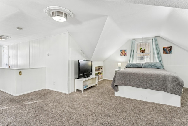 carpeted bedroom featuring lofted ceiling