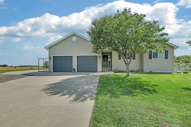 view of front of property featuring a front yard and a garage