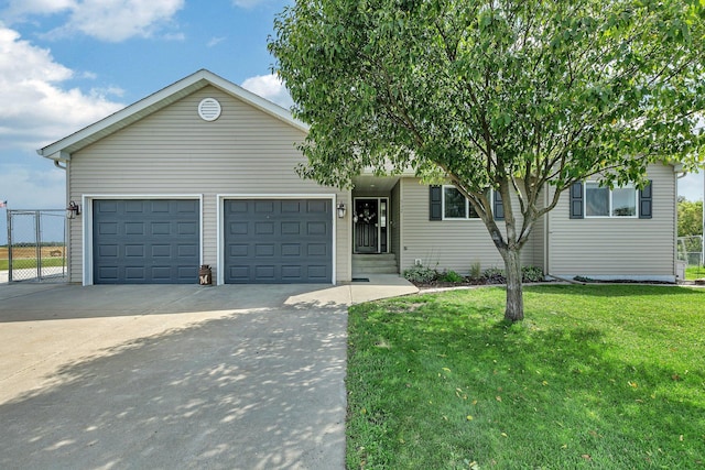 view of front of house featuring a garage and a front lawn