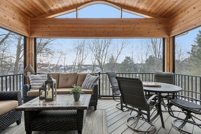 snow covered deck featuring an outdoor living space and a gazebo