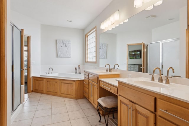 bathroom with vanity, independent shower and bath, and tile patterned flooring