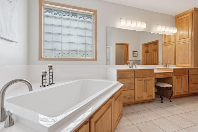 bathroom featuring tile patterned floors, separate shower and tub, and vanity