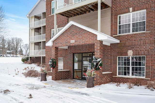 view of snow covered property entrance