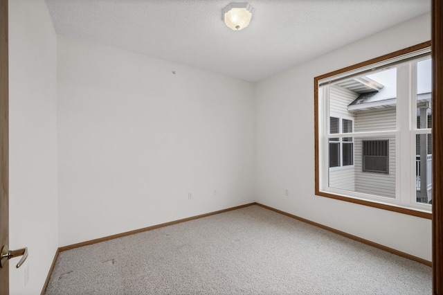 unfurnished room with carpet floors