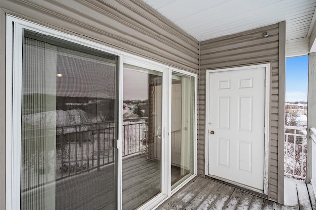 view of snow covered property entrance