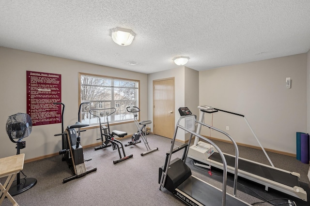 workout room with a textured ceiling