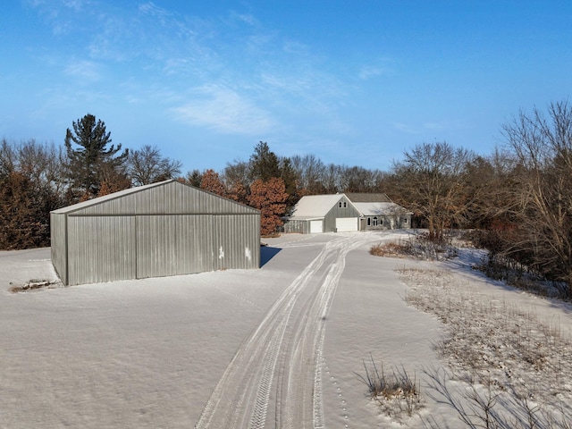 exterior space with an outbuilding, a detached garage, and an outdoor structure