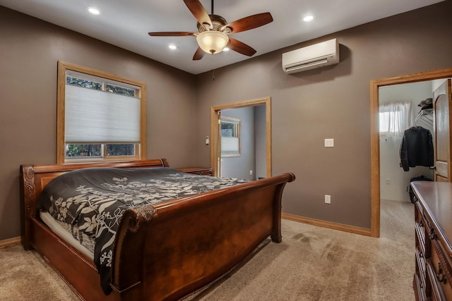 bedroom featuring recessed lighting, a ceiling fan, light carpet, a wall mounted air conditioner, and baseboards