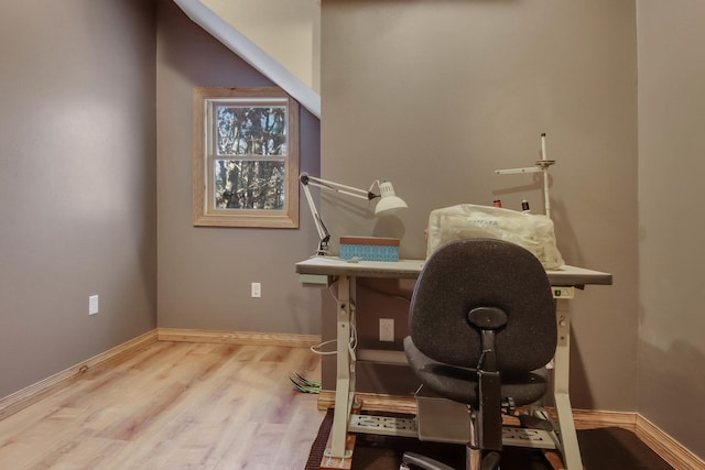 home office with light wood finished floors and baseboards