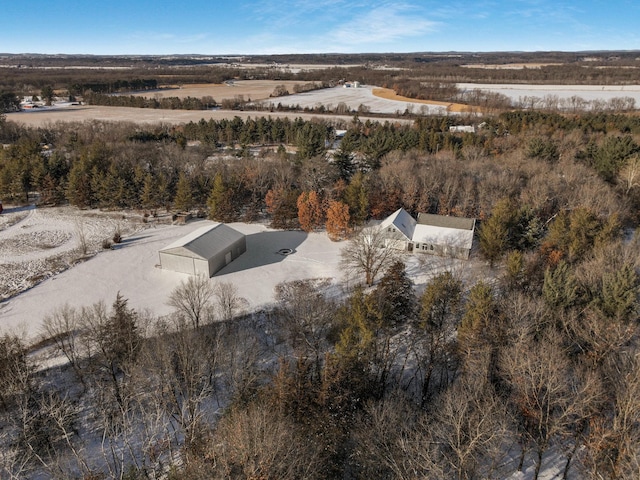 birds eye view of property featuring a view of trees