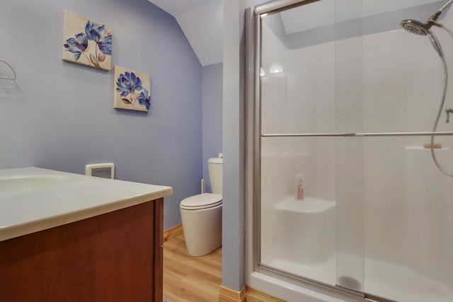 N1865 980th St, Rock Creek Twp, WI 54701 - full bath with vaulted ceiling, a stall shower, wood finished floors, vanity, and toilet