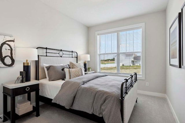 bedroom featuring light carpet