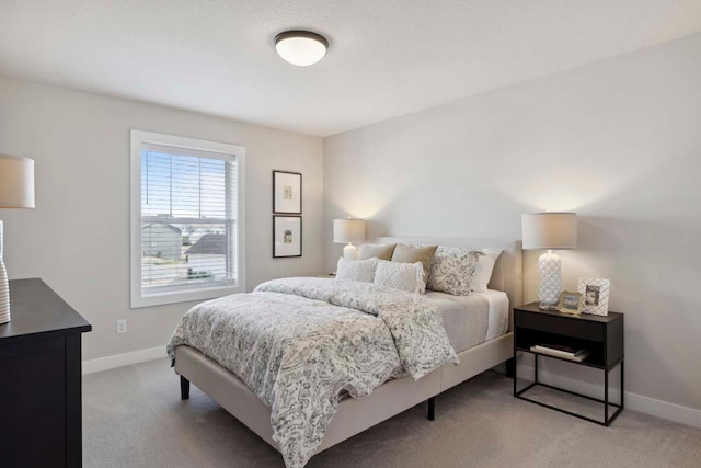 bedroom with light colored carpet