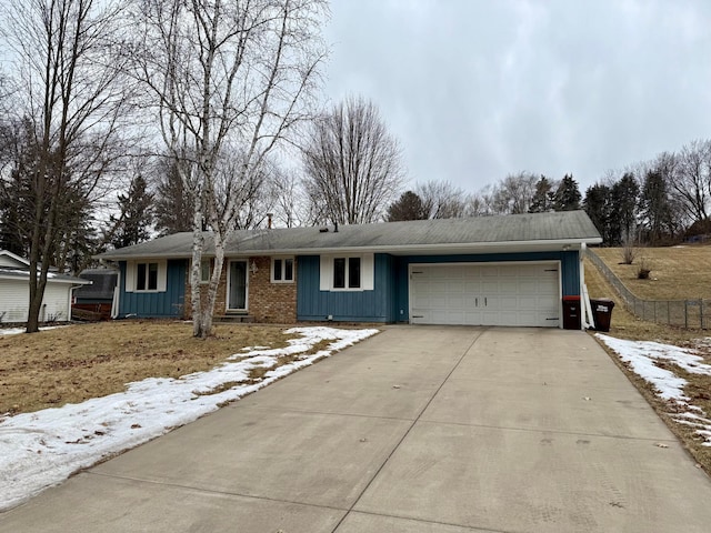 single story home featuring a garage