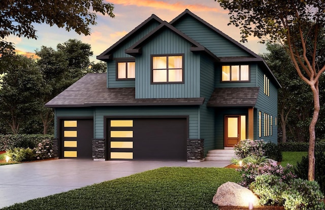 craftsman house featuring a yard and a garage