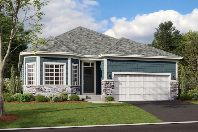 view of front of home with a garage and a front lawn