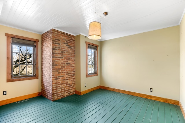 unfurnished room featuring hardwood / wood-style floors and crown molding