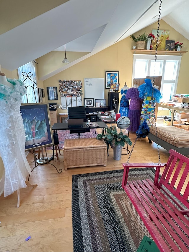 living room with hardwood / wood-style floors and vaulted ceiling