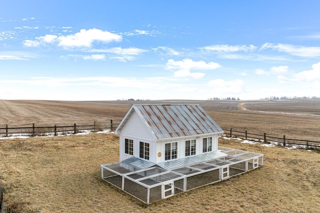 exterior space featuring an outbuilding and a rural view