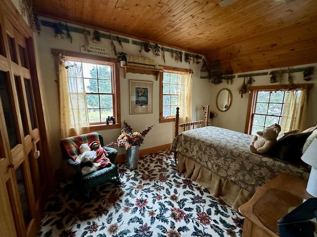 bedroom with lofted ceiling and wood ceiling