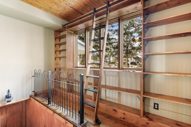 interior space with wooden ceiling and wood walls