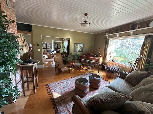 living room featuring ornamental molding and hardwood / wood-style floors