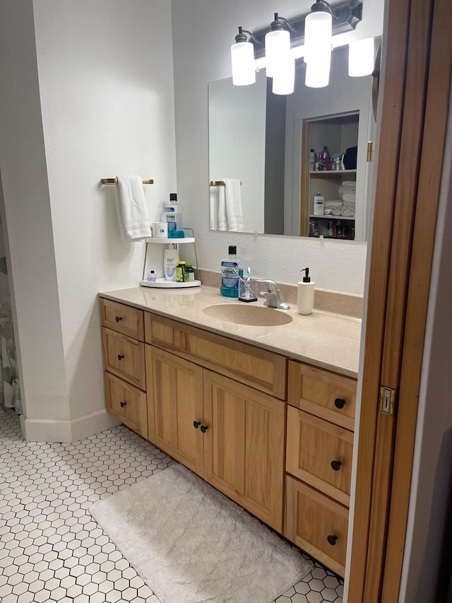 bathroom with vanity and tile patterned flooring